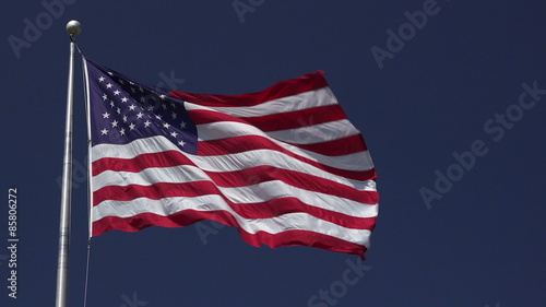 Red, white and blue.  Beautiful jumbo United States flag waving in the wind.