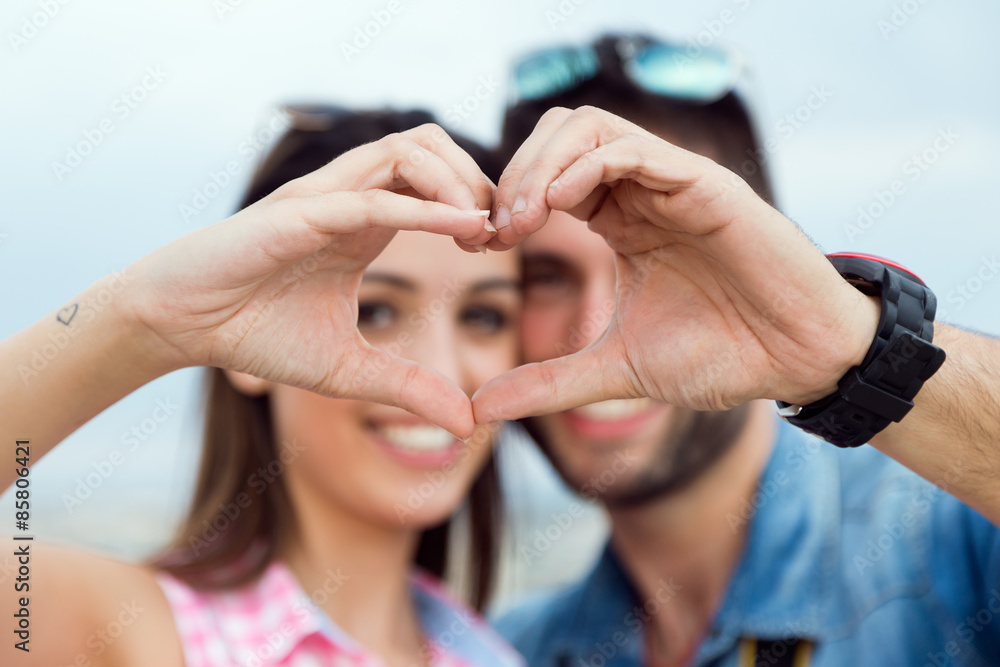 Fototapeta premium Young couple in love on the street