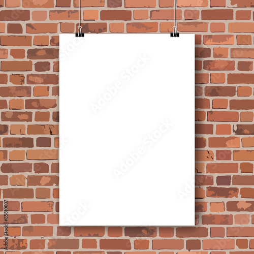 Blank paper poster on red brick wall