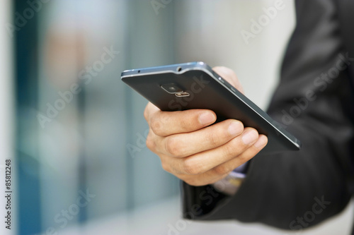 Business Man Holding Phablet Smartphone And Watching E-mail