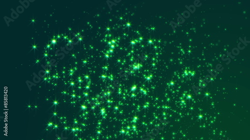 Looped dark green background with slowly flying glowing particles