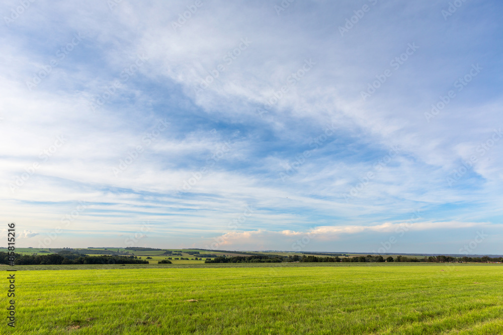 Thin clouds over green pastures Thin clouds over green pastures