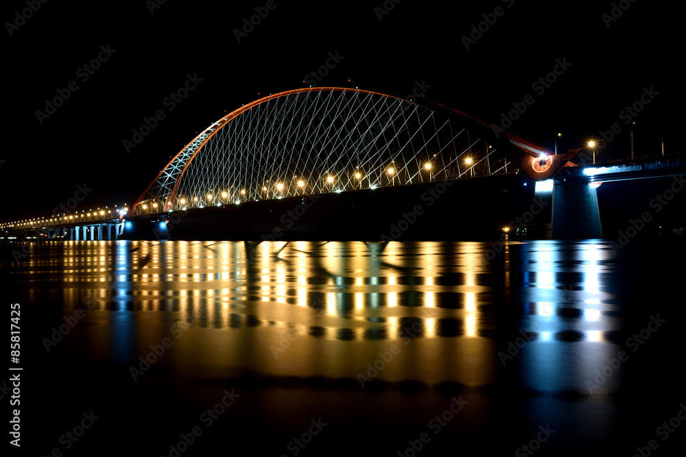 Bridge with red arch in night light
