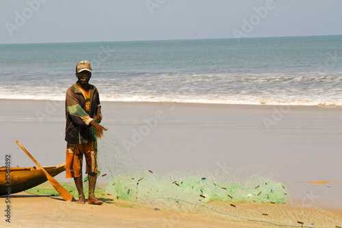 Fisherman pulling a fishing net on madagascar beach
