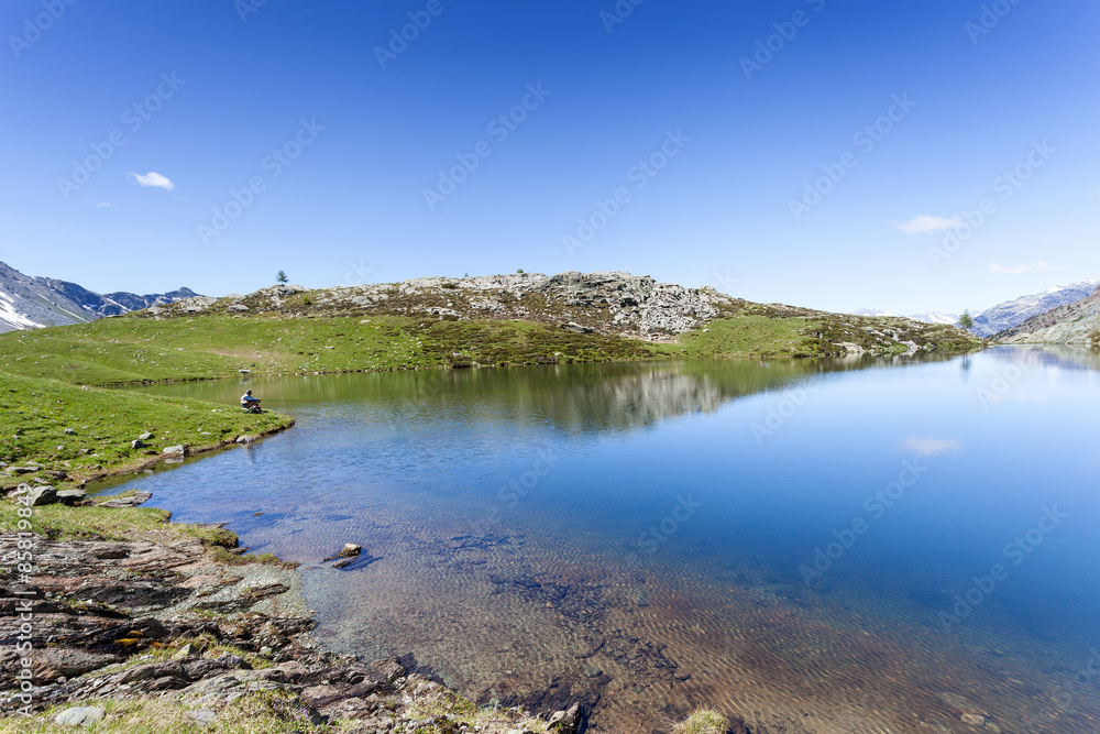 Fototapeta premium pescatore d'alta montagna