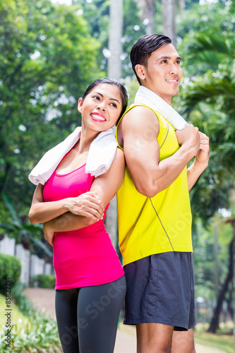Asian woman and man during running training