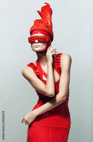 pretty woman in red sunglasses and dress