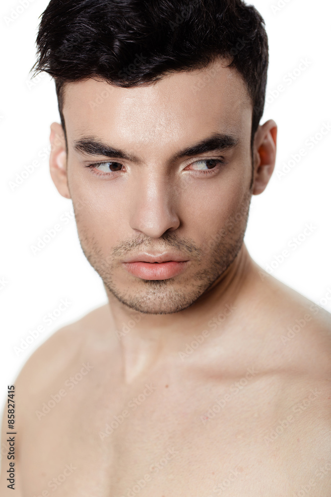 Charming and handsome man face over a white background Charming and handsome man face over a white background