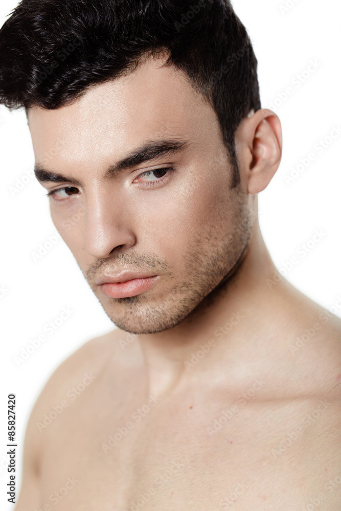 Obraz premium Charming and handsome man face over a white background