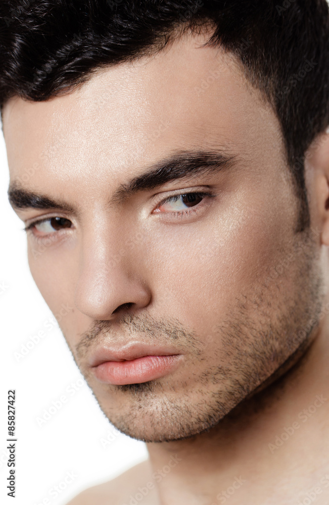 Charming and handsome man face over a white background Charming and handsome man face over a white background