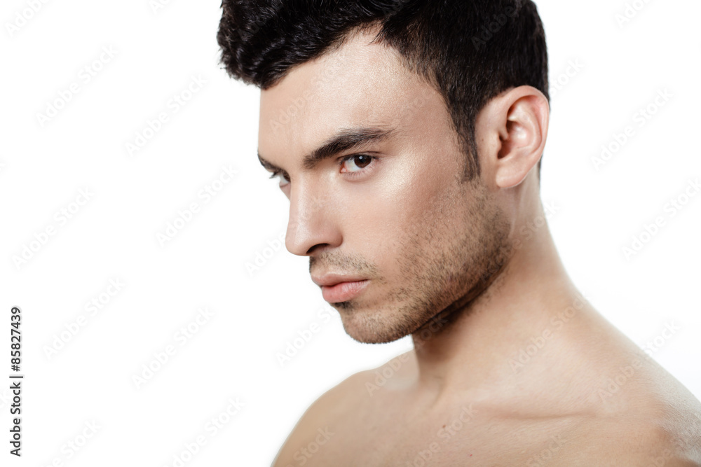 Obraz premium Charming and handsome man face over a white background