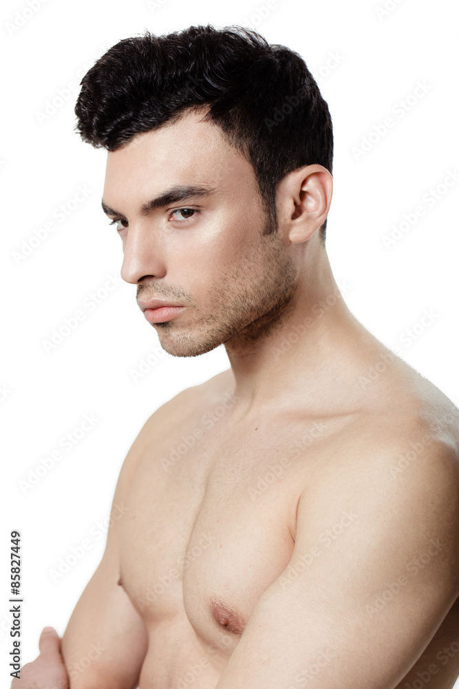 Fototapeta premium Charming and handsome man face over a white background