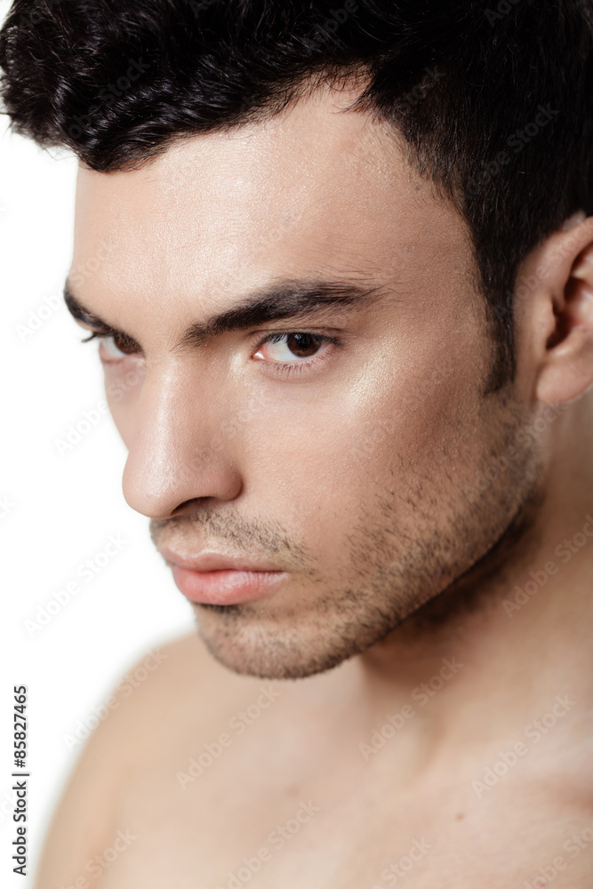 Charming and handsome man face over a white background Charming and handsome man face over a white background