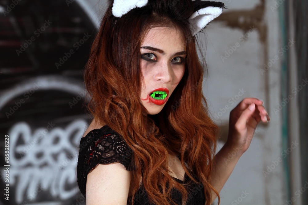 Beautiful Young woman as sexy vampire - halloween portrait Beautiful Young woman as sexy vampire - halloween portrait