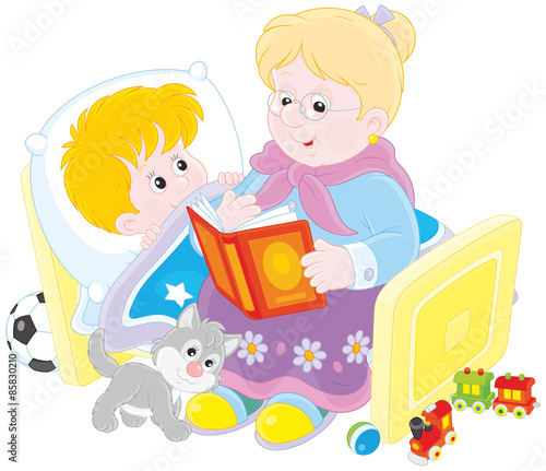 Grandmother reading aloud a book of fairy tales to her grandchild lying in his bed