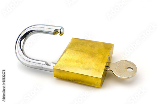 Unlocked padlock with the key on white background
