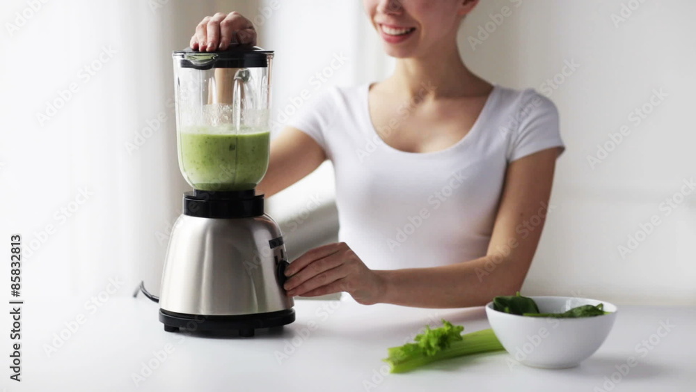 smiling woman with blender and green vegetables smiling woman with blender and green vegetables