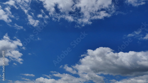 Clouds drifting following the blue sky, time-lapse  photo