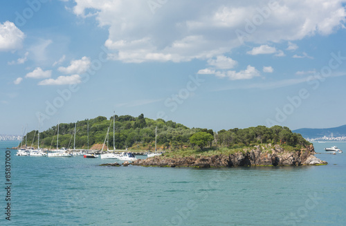 Small island with sailing boats in bosphorus