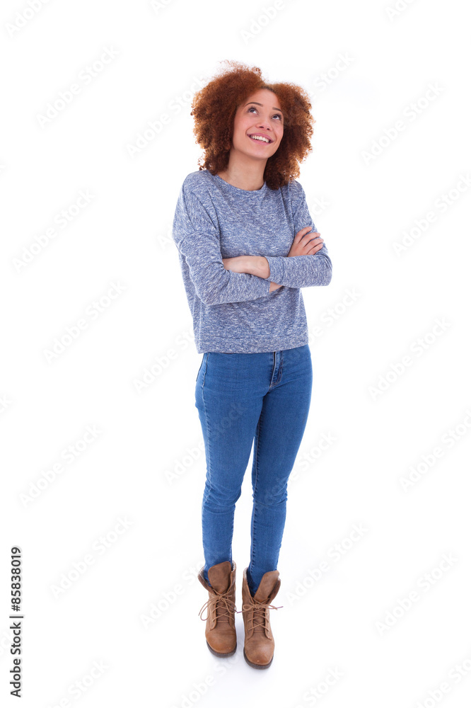 Young african american teenage girl looking up, isolated on whit Young african american teenage girl looking up, isolated on whit