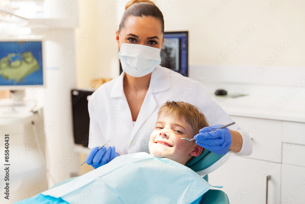 little boy getting dental checkup