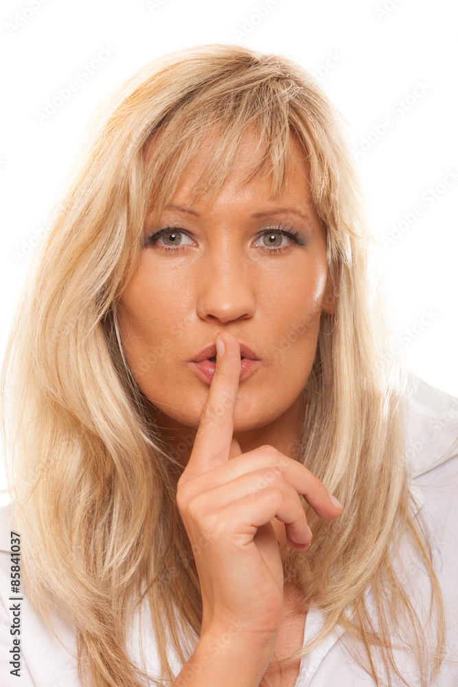Woman asking for silence finger on lips hush gesture. Woman asking for silence finger on lips hush gesture.