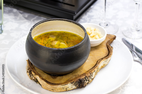 soup with beans and mushrooms garnished with goat cheese photo