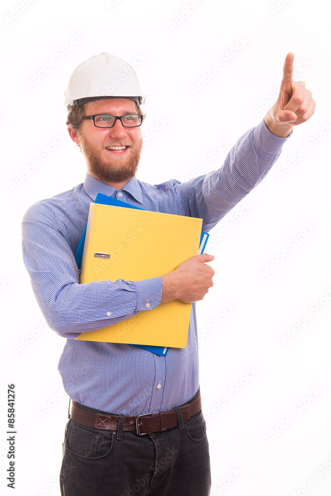 Young happy engineer in helmet pointing with finger Young happy engineer in helmet pointing with finger