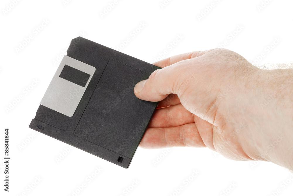 Hand holding diskette Hand holding diskette