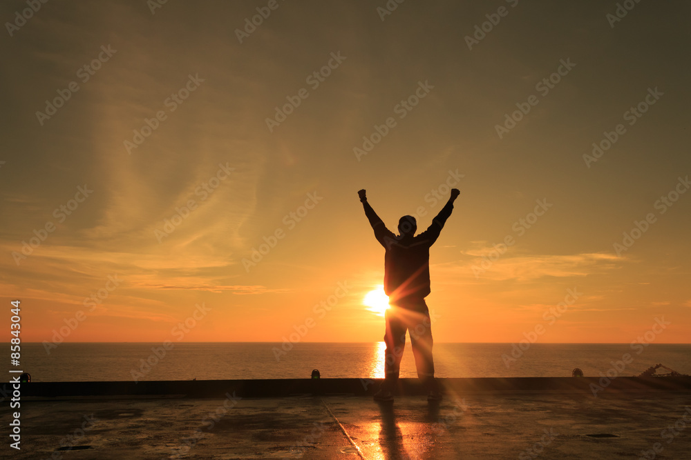 Fototapeta premium Silhouette Image of Happy Man Showing Winner Action