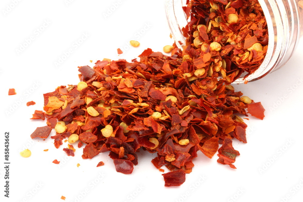 Red Chili Flakes on White Background Red Chili Flakes on White Background