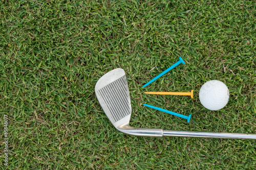 Golf Ball and Golf Club on grass