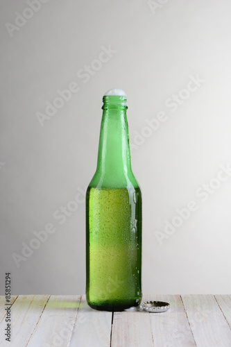 Single Bottle of Beer with Foam