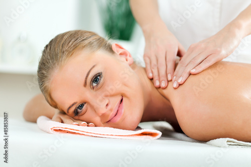 Young woman having massage on spa treatment
