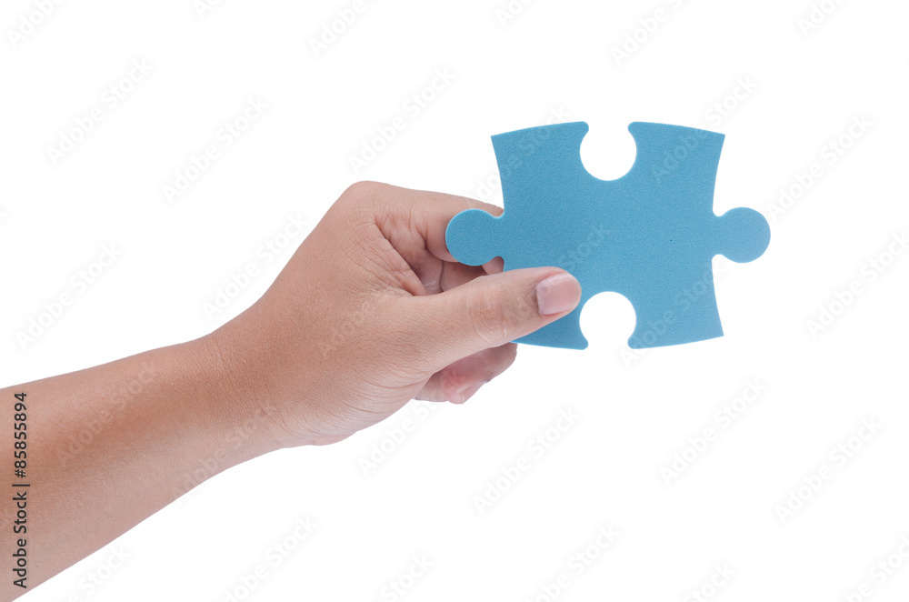 man hand holding jigzaw isolated on white background man hand holding jigzaw isolated on white background