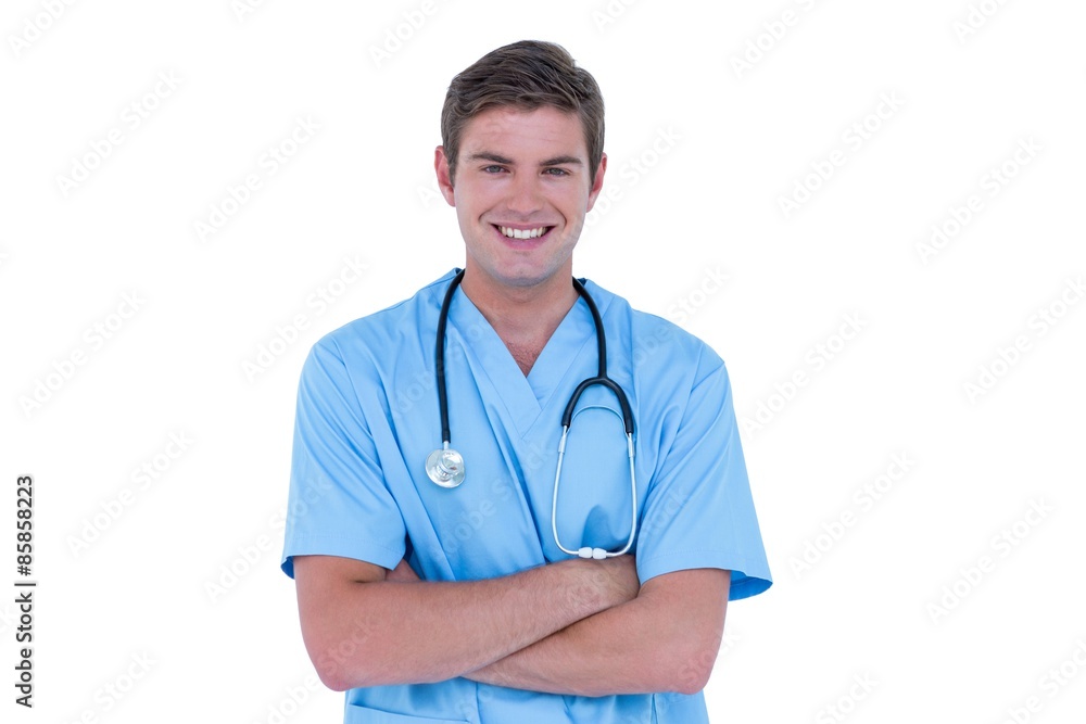 Young nurse in blue tunic with arms crossed Young nurse in blue tunic with arms crossed