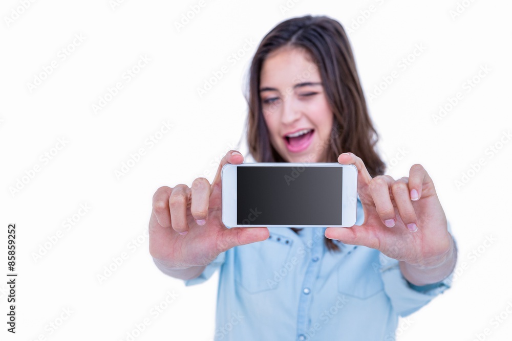 Pretty brunette taking a selfie with smartphone Pretty brunette taking a selfie with smartphone
