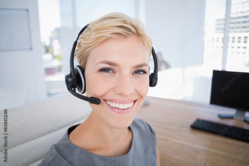 Businesswoman wearing a work headset Businesswoman wearing a work headset