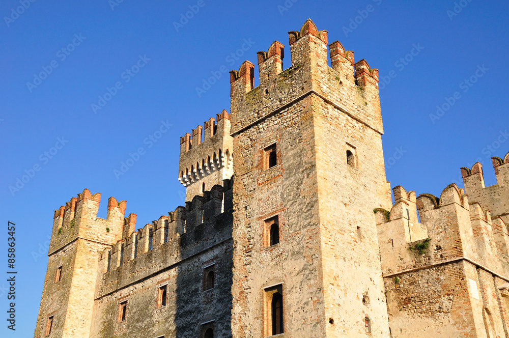 Old castle towers with big merlons. Sirmione town. Italy. 