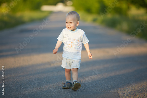 boy run on the road © photoniko