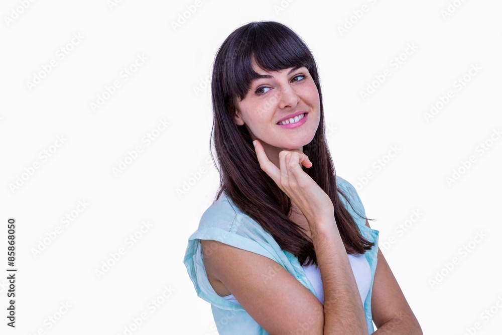 Pretty brunette with finger on chin looking away Pretty brunette with finger on chin looking away