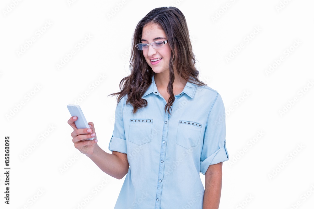 Pretty geeky hipster using her smartphone Pretty geeky hipster using her smartphone