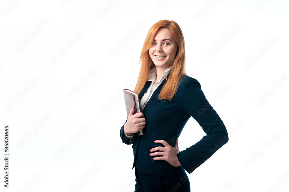 Red-haired businesswoman with a diary in hands Red-haired businesswoman with a diary in hands