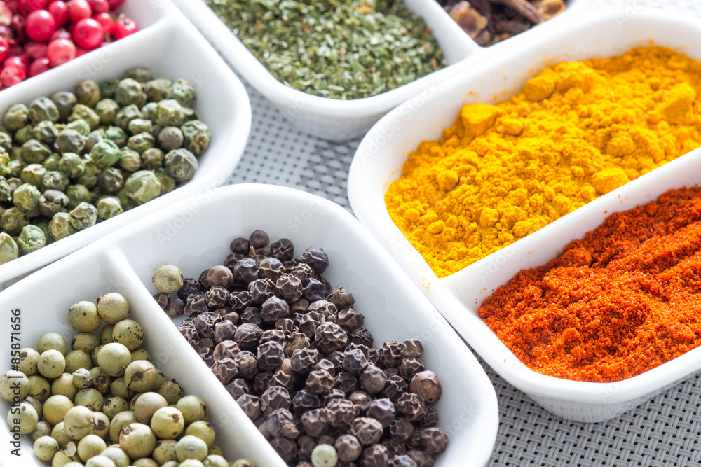 Colorful herbs,spices and aromatic ingredients on modern table.