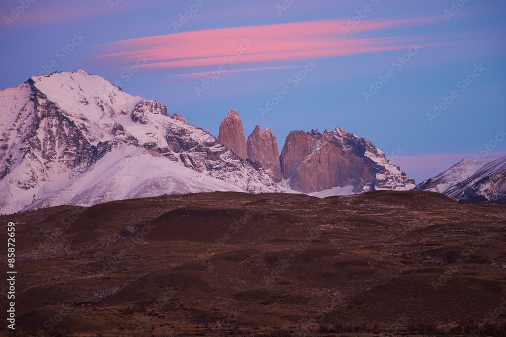 Sunrise over the granite spires that give the name to the Torres del Paine National Park in Patagonia, Chile.
