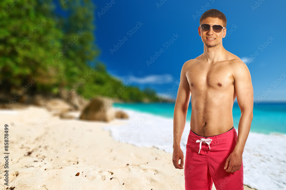 Man on Anse Intendance beach at Seychelles