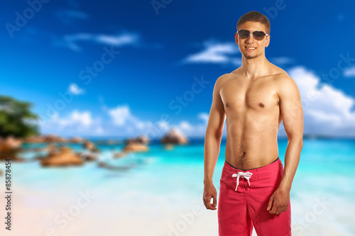 Man on beach at Seychelles