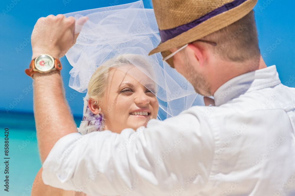 Obraz premium bride and groom enjoying beach wedding in tropics, on wedding ar