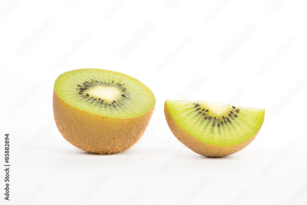 Sliced and cut kiwi fruit on white Sliced and cut kiwi fruit on white