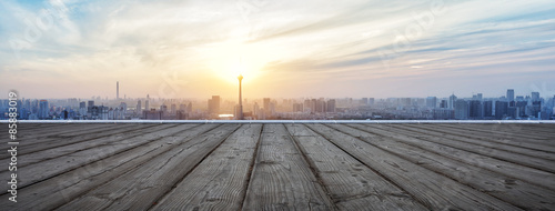 Panoramic skyline and buildings with empty wooden board